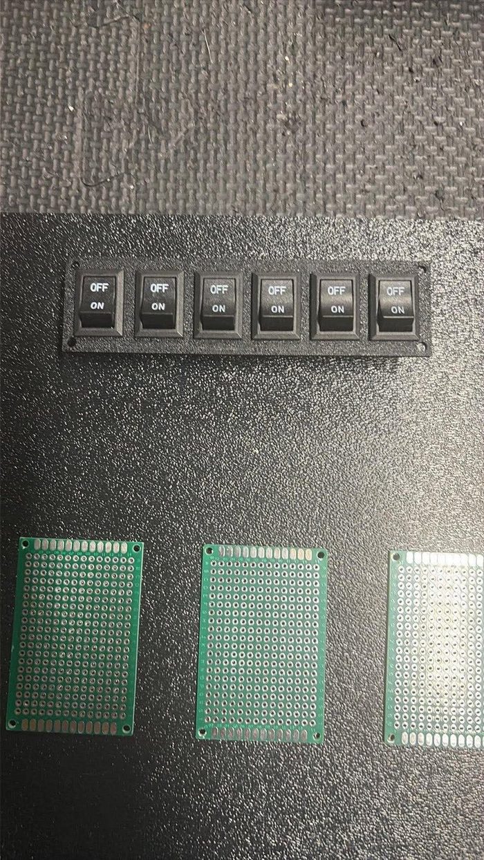 3D printed switch panel with six rocker switches, mounted in an amp cabinet