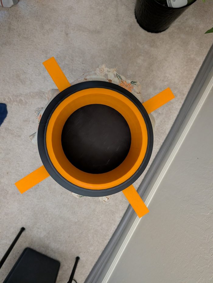 DuckyBuilds TipGuard tiffin holder, black and orange, bird's eye view